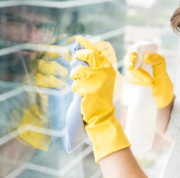 man cleaning window