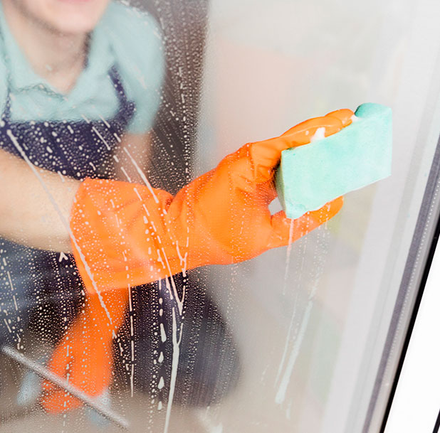 man cleaning window