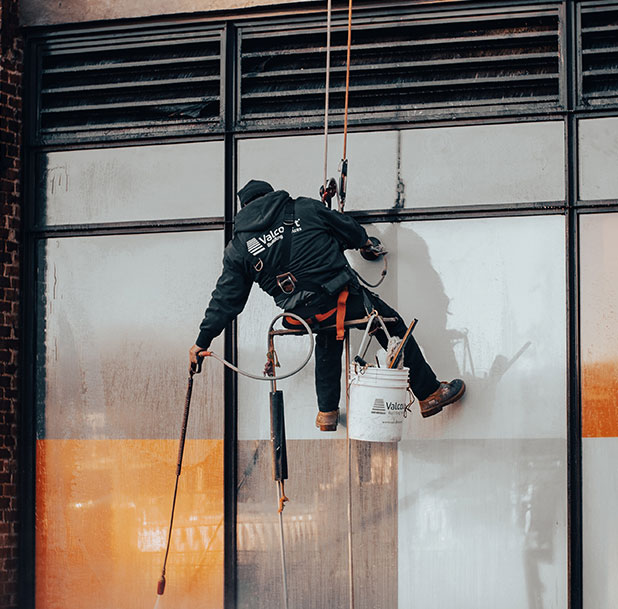 man cleaning window